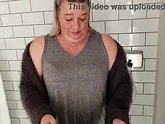 Watch New Zealand mature slut naked and showing in public bathroom