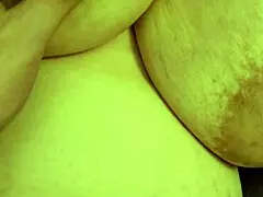 Mature beauty flaunts assets boldly