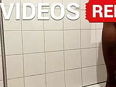 Hot naked bald mature woman beautifully washes her legs in a shower