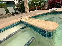 Amonia: Mature woman with a shaved pussy sunbathes topless by the pool