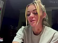 Petite blonde rubs her nips and fingerings her pussy