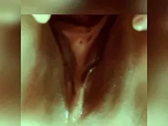 A shaved and mature woman pleases herself by fingering and rubbing her pussy