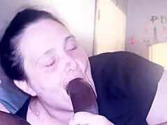 A milf with no teeth gives a great gumjob and accidentally cums on face