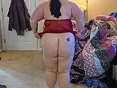 A fat girl in sexy underwear shows her charms