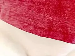 A mature woman is sliding her pussy, showcasing its wetness