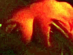 A guy is having fun with his stepmom in a red room