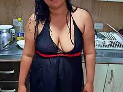 This horny Latina stepmom squirts in the kitchen while teasing her stepson.