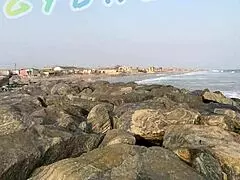 couple gets sneaky playing voyeur at a crowded public bar and beach.