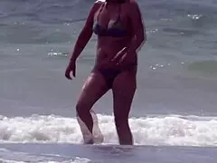 on the beach, i satisfy my friend with care. her stepson joins for an intimate finish.