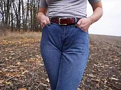 yo, check this milf teasing her huge cameltoe in tight blue jeans outside! 😍