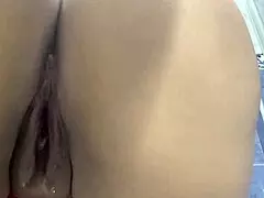 Public bathroom cam catches curvy Latina in steamy moment.