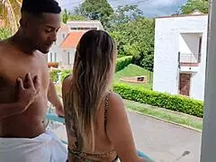 Mara and Rioc share a quick kiss on the balcony thinking no one is watching them